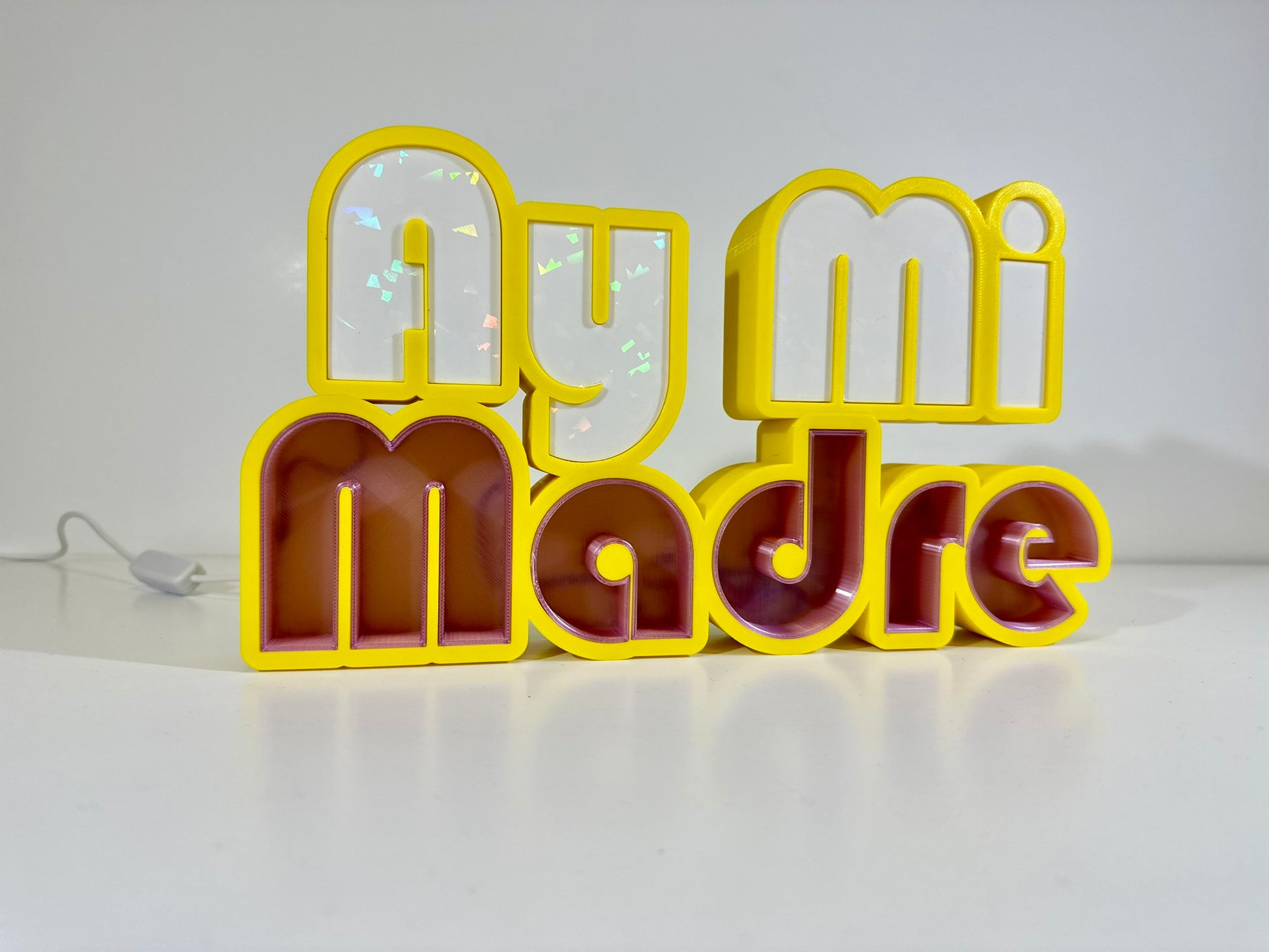 Front view of Ay Mi Madre LED Channel Letter Sign in yellow with red and white letters, displayed against a white background.