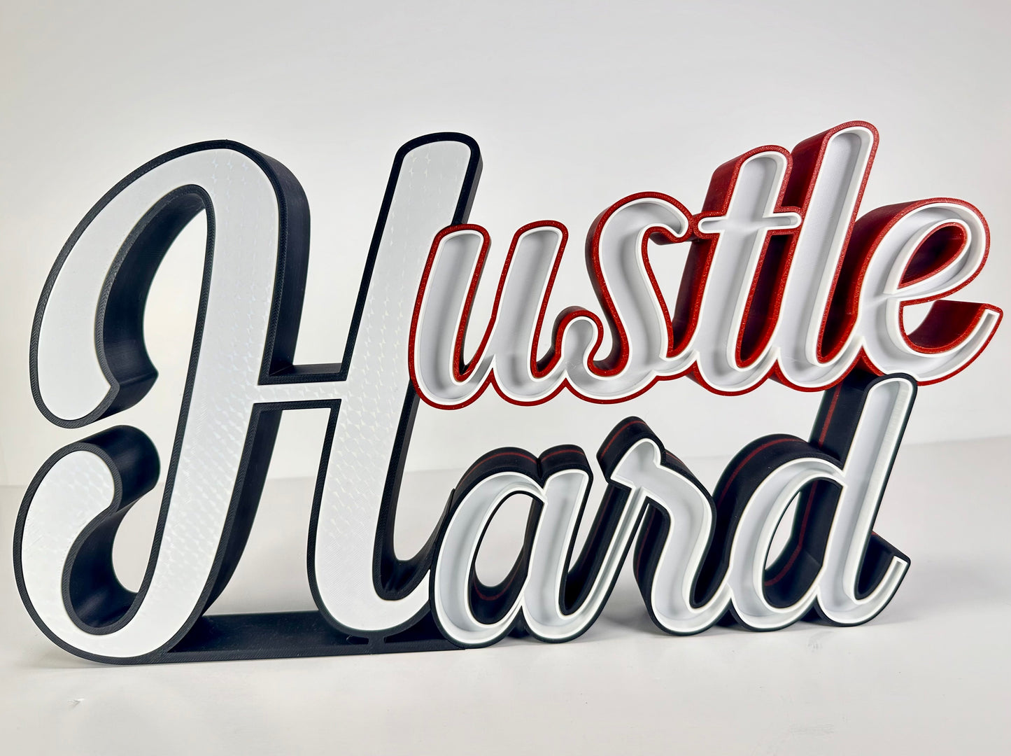 Medium hustle hard sign