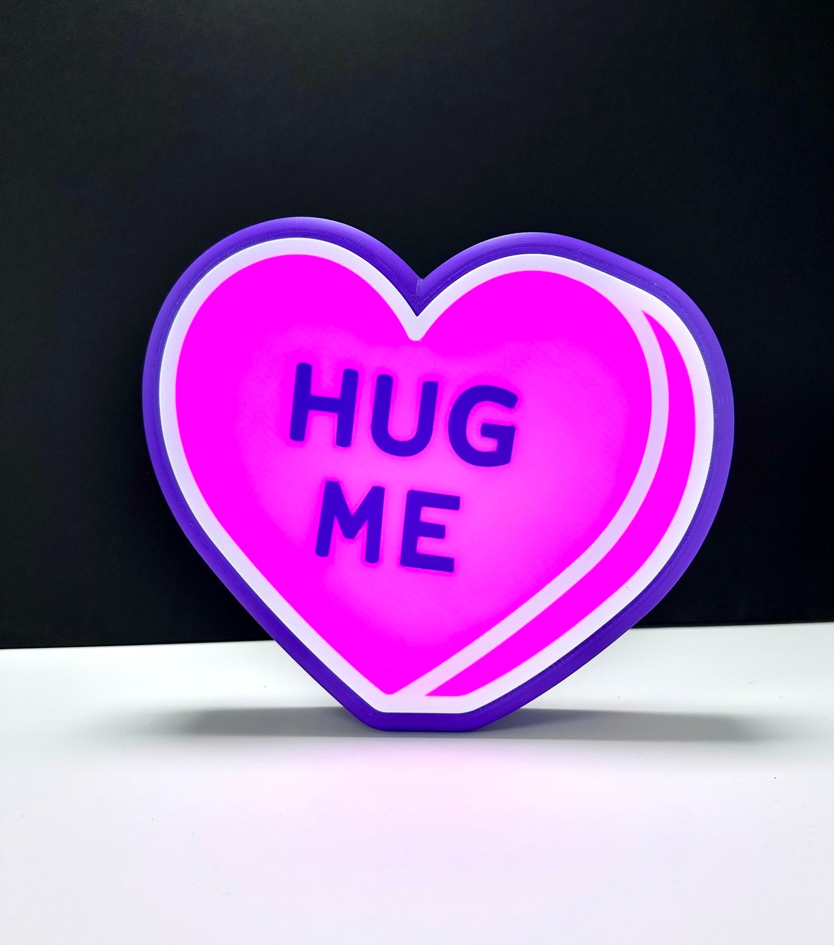 Purple LED heart sign with 'HUG ME.' Custom Valentine’s Day decoration.