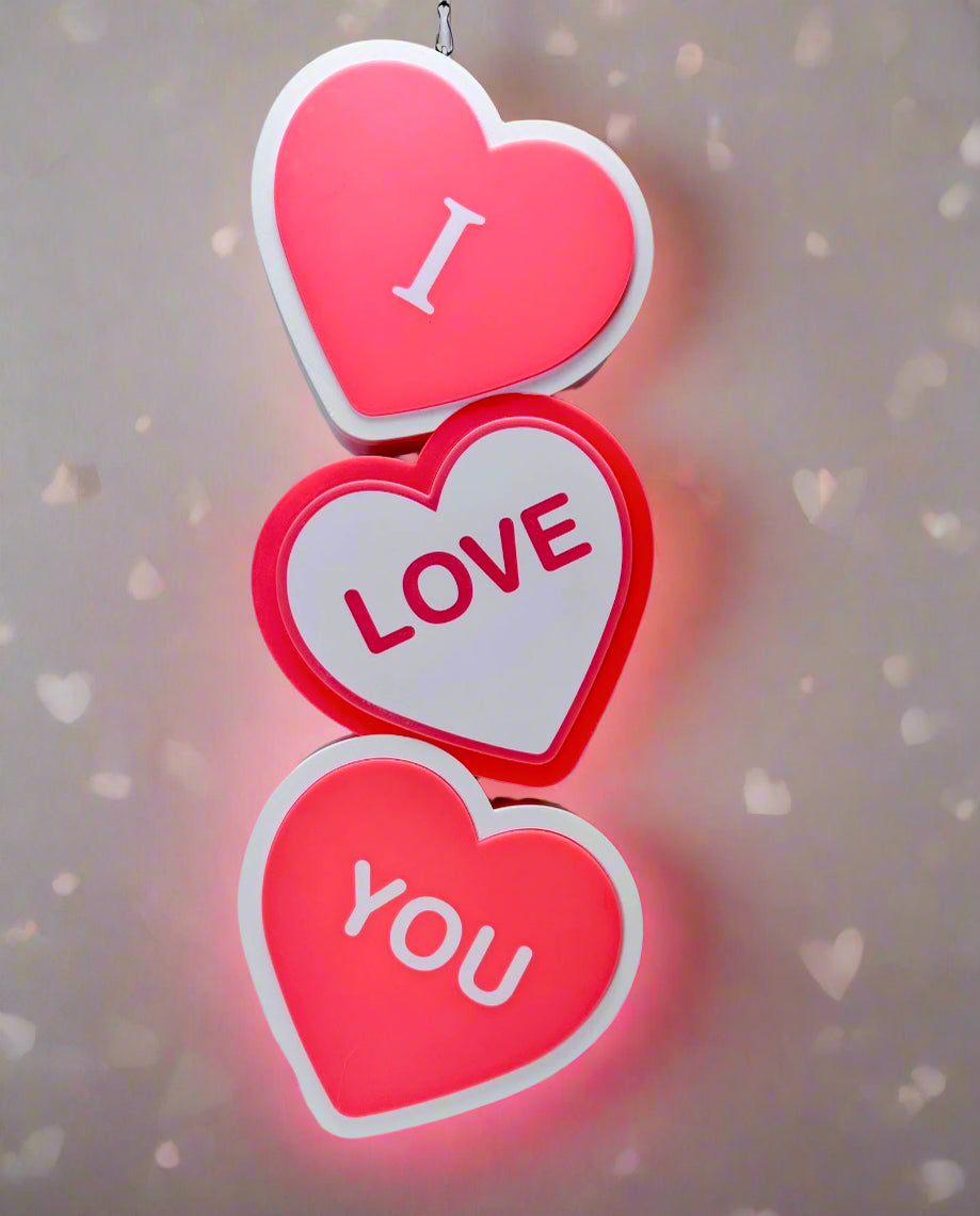Hanging I Love You LED Sign with heart-shaped layers, romantic lighting