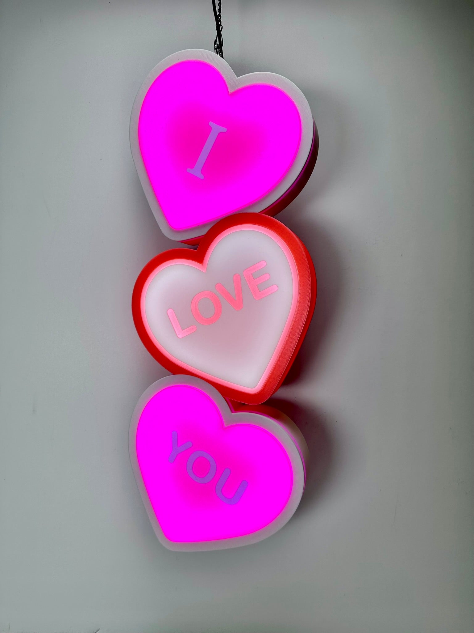 I Love You LED Sign glowing pink, soft ambient lighting for romantic spaces.