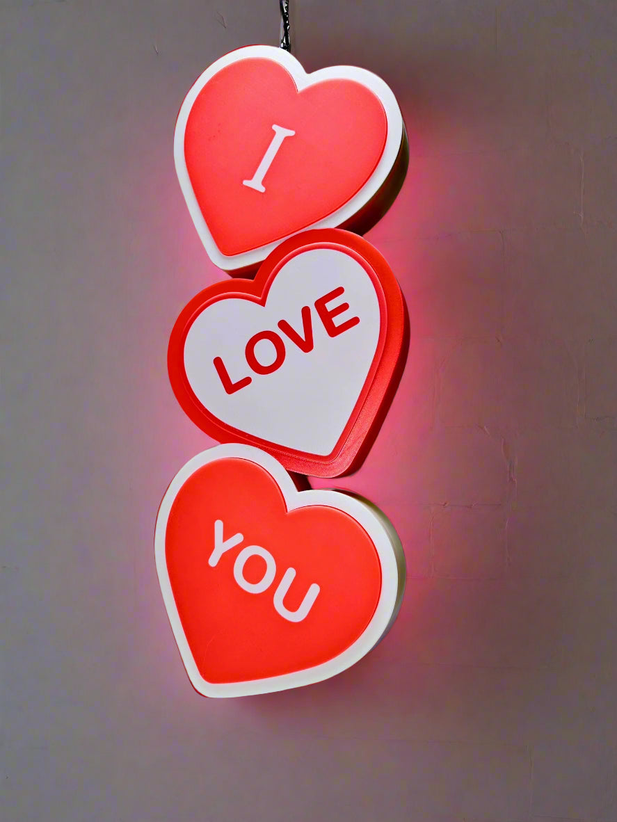 Close-up of I Love You LED Sign, 3D-printed with bold red and white colors.