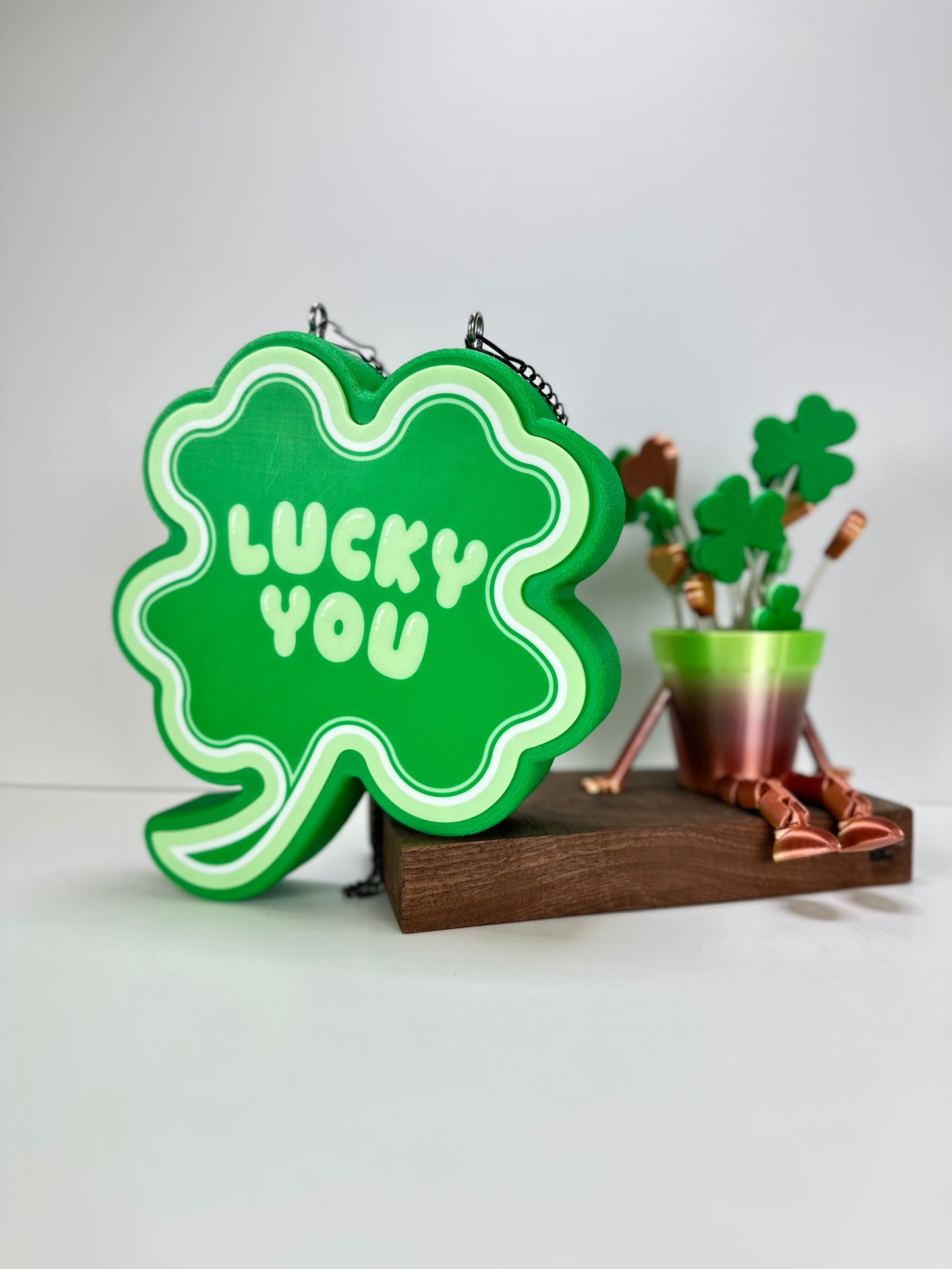 St. Patrick’s Day-themed decor setup featuring the Shamrock LED sign and festive green plant