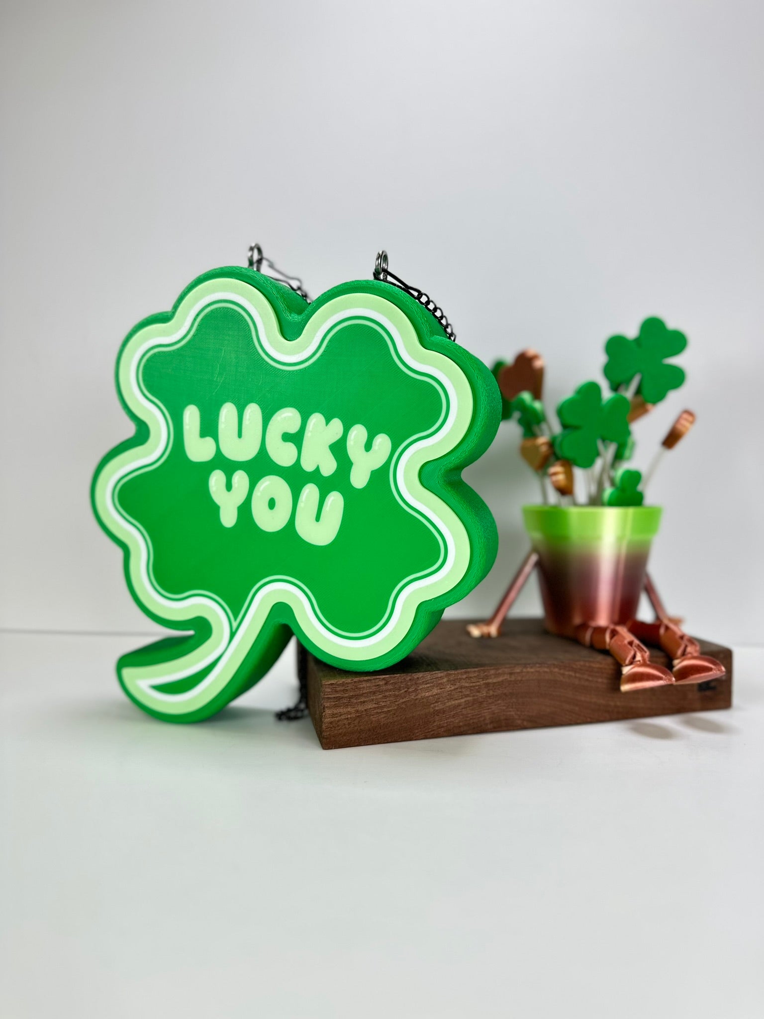 St. Patrick’s Day-themed decor setup featuring the Shamrock LED sign and festive green plant