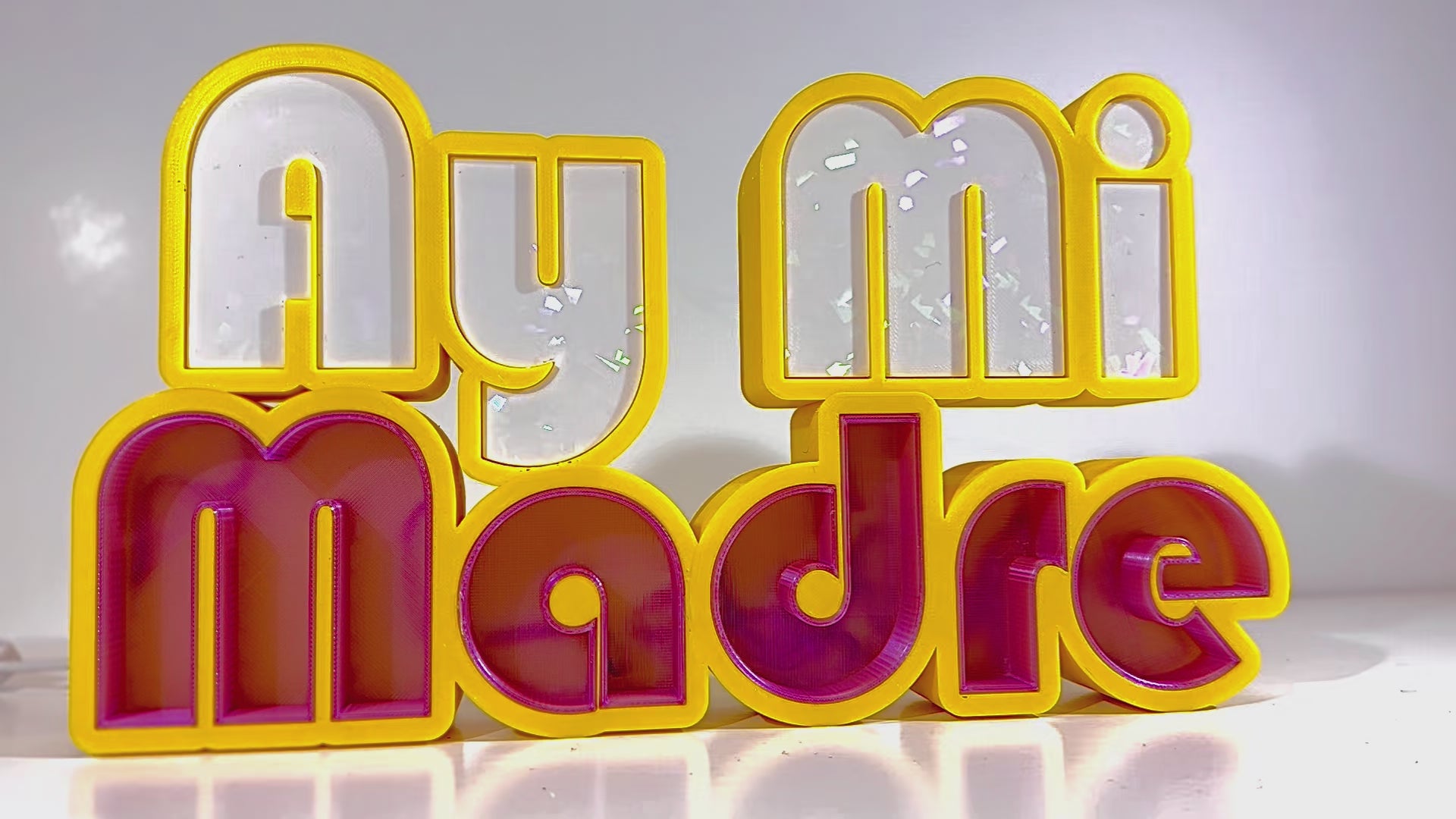 video of yellow white and purple led sign