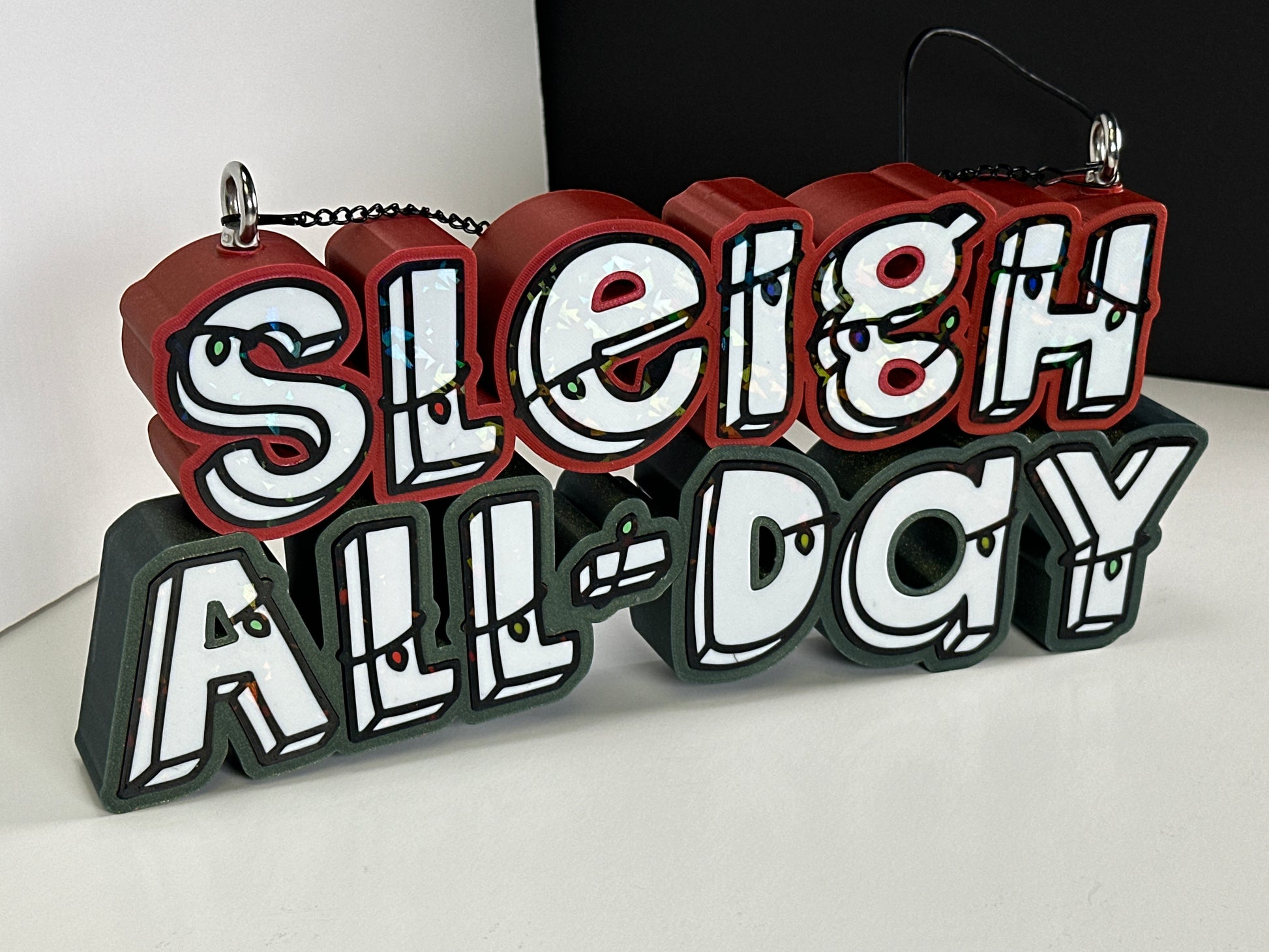 Close-up of Sleigh All Day sign colors