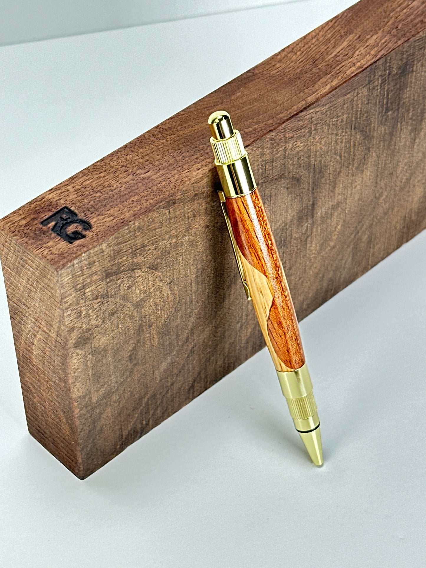 Pen leaning on a wooden block