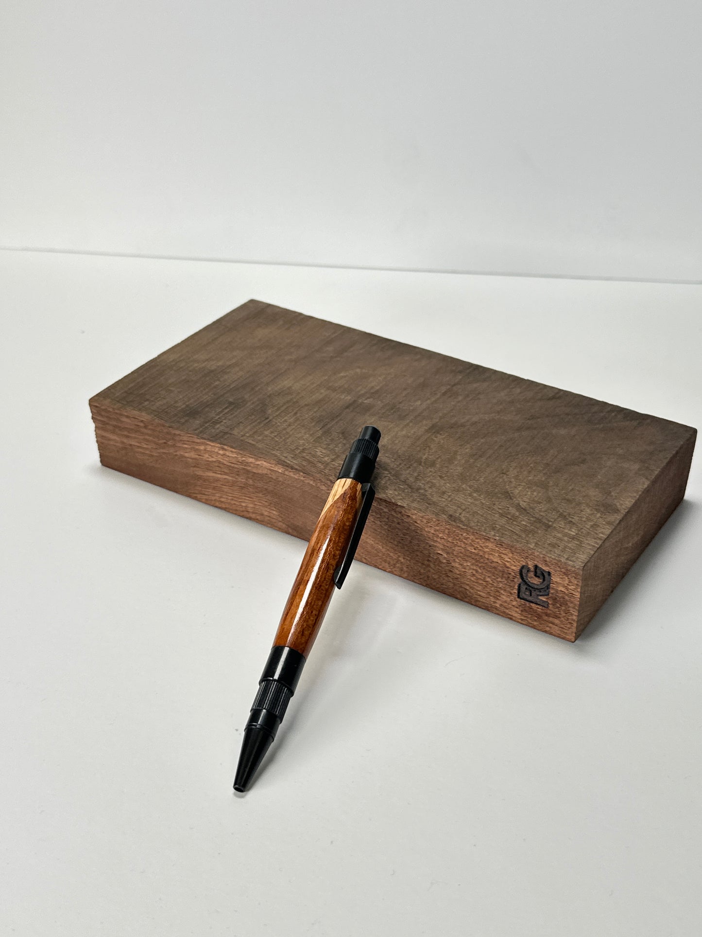 Wooden pen on a flat block