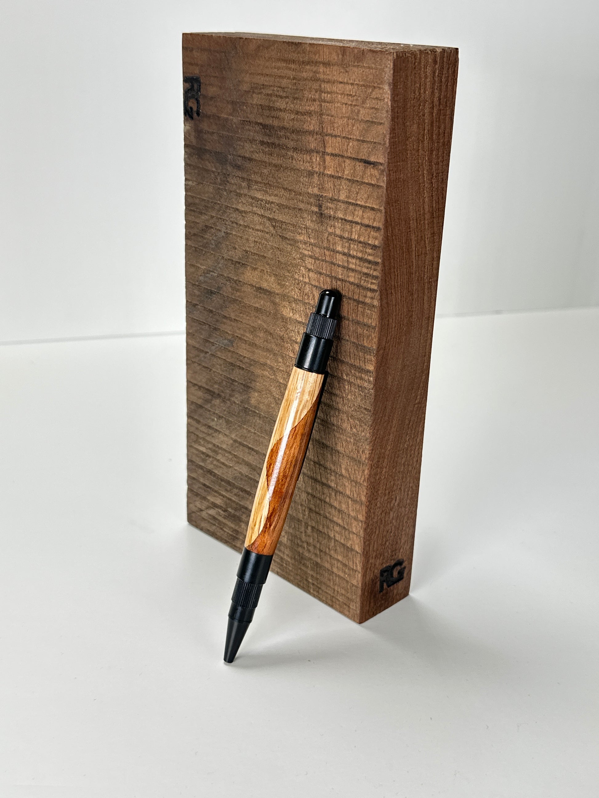 Pen displayed in a wooden stand
