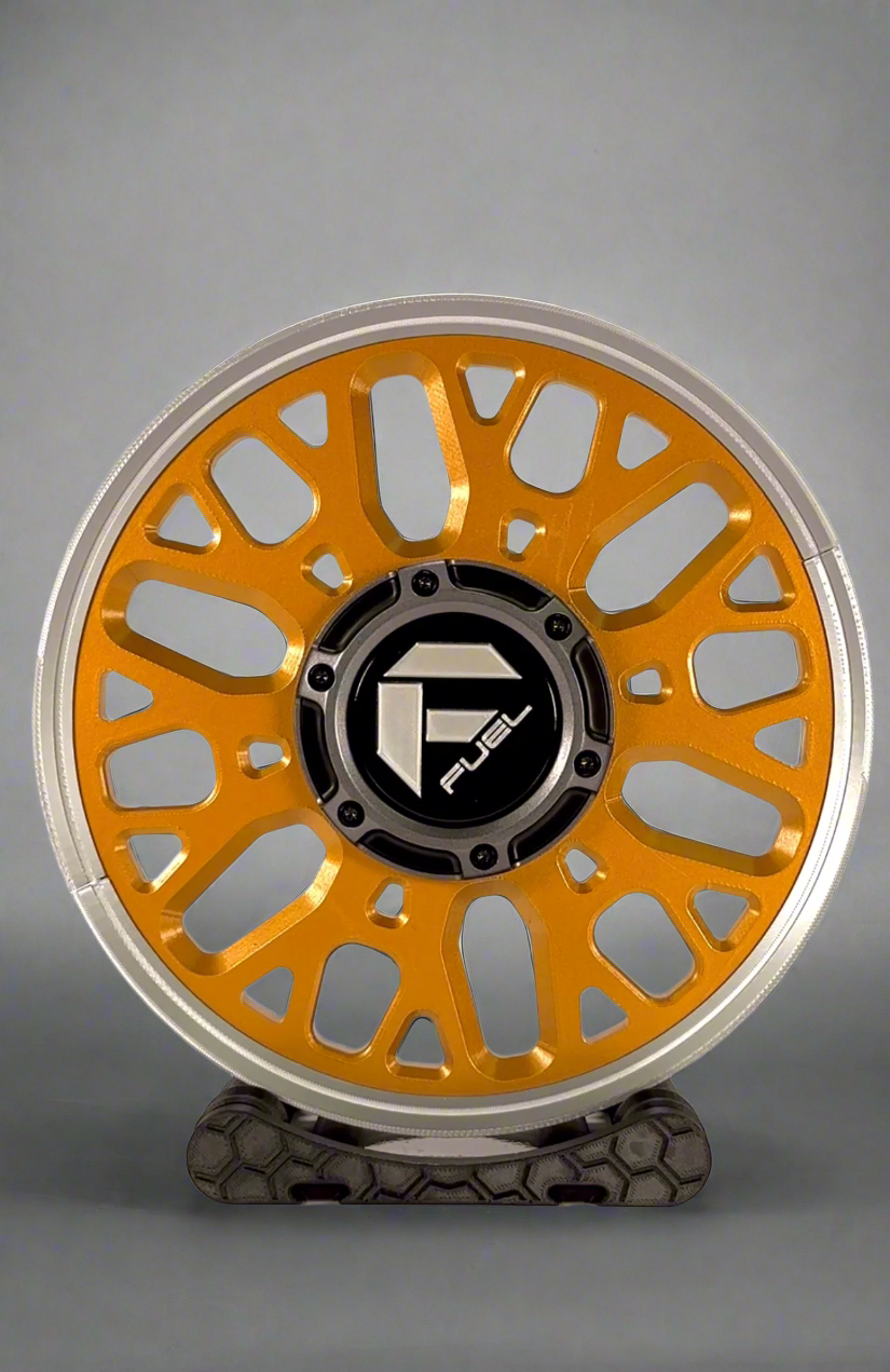 Orange and silver wheel rim on a white background