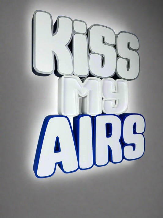 Angled side view of the Kiss My Airs LED Channel Letter Sign, highlighting the 3D construction and bold white letters, displayed against a white background.