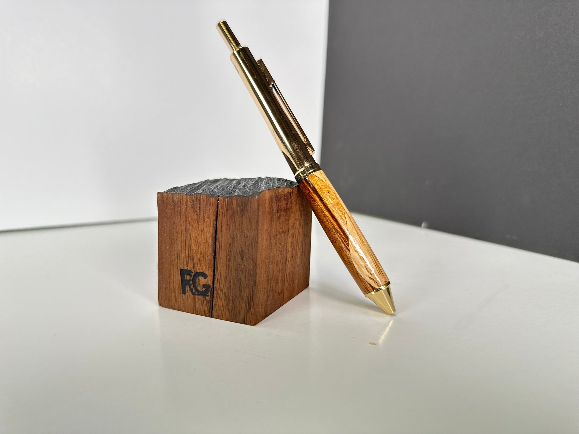 Handcrafted pen with oak and zebrawood grain.